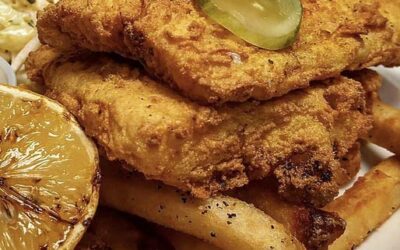 golden fried cod and chips on a plate