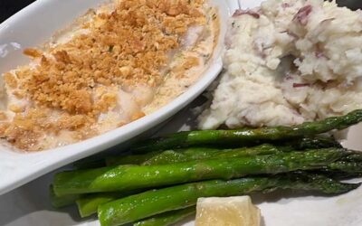casserole dish on a plate with mashed potatoes and green beans
