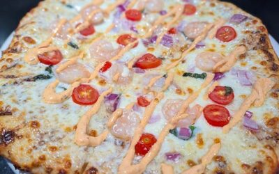 shrimp and aoili on a pizza