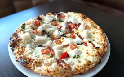 scallop and bacon pizza ready to be served